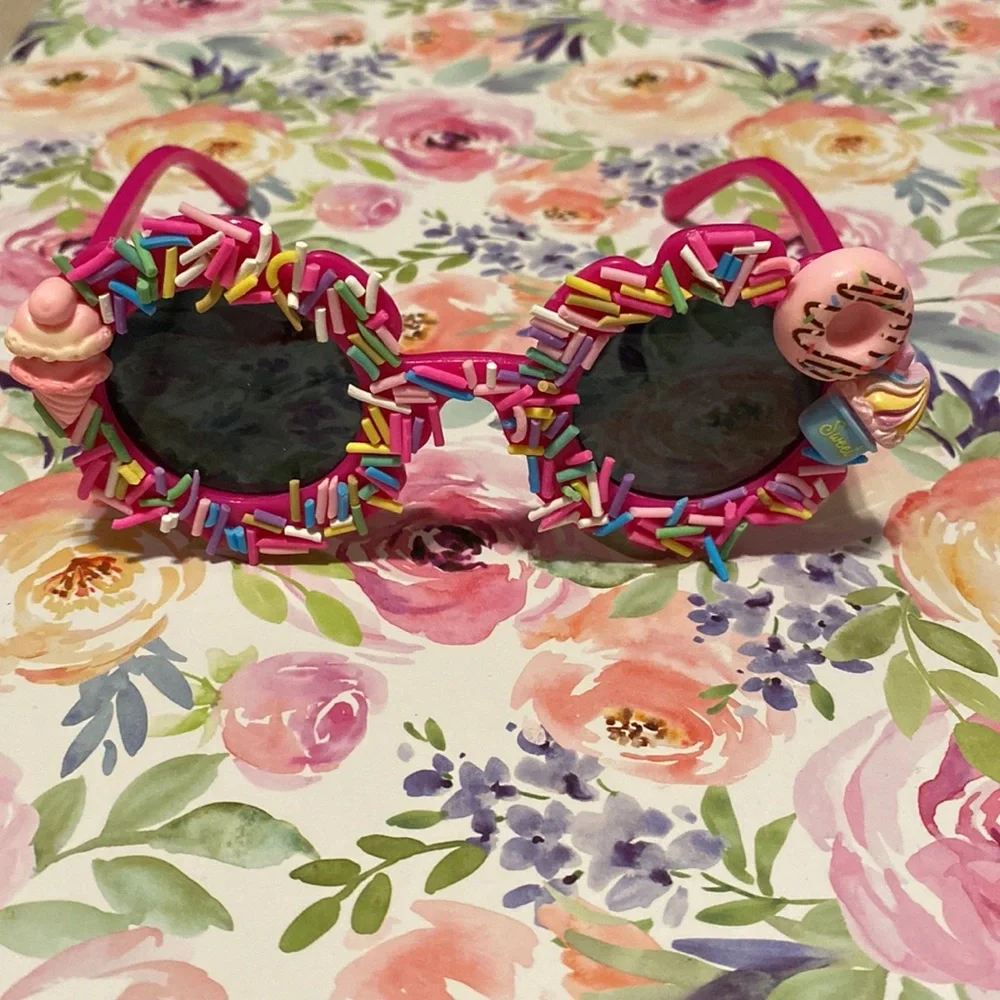 Girls hot pink flower shaped sprinkle sunglasses